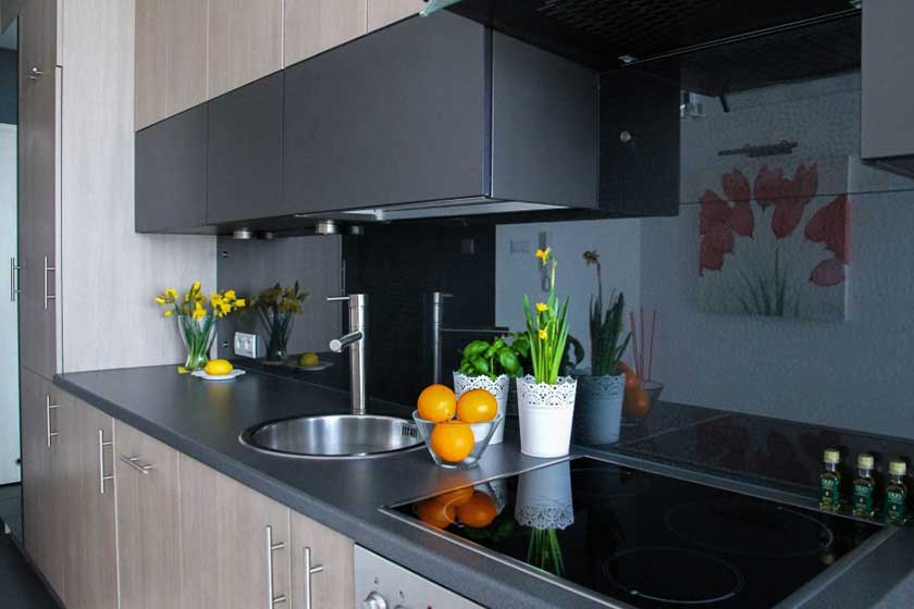 Glass composite countertop option, a perfect appearance with fruit jars and flowers.