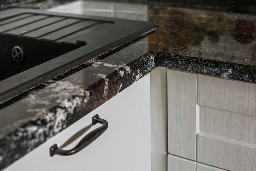 Granite countertop is one of the best kitchen option that has white cabinets.