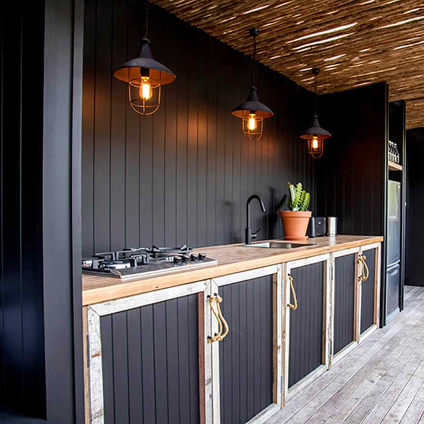 black kitchen cabinets with bamboo straw roof