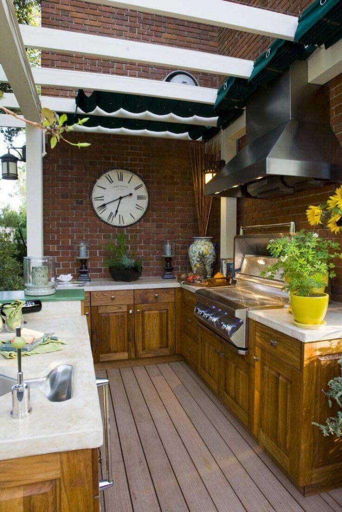outside kitchen with yellow lower pot and dark wood structure
