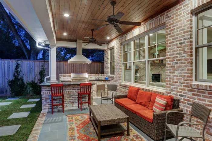 brick walls with outdoor kitchen and sitting place