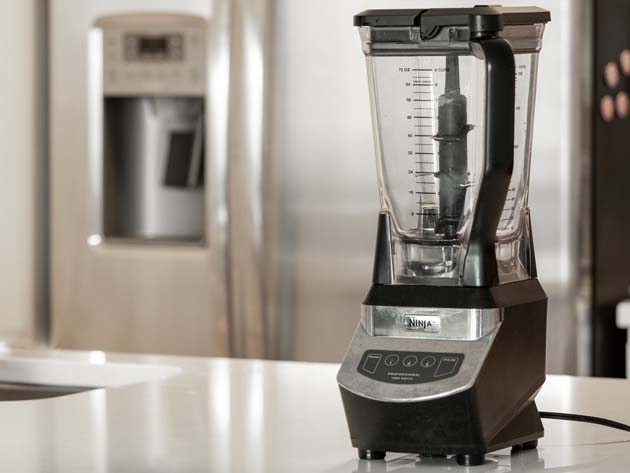 A high-speed blender placed on a countertop is a useful small kitchen appliance.