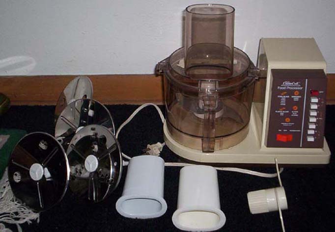 An old fashioned food processor with it's parts, is a useful small kitchen appliance. 